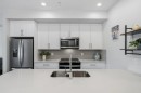 224-255 Les Jardins Park Se, Calgary, AB  - Indoor Photo Showing Kitchen With Stainless Steel Kitchen With Double Sink With Upgraded Kitchen 