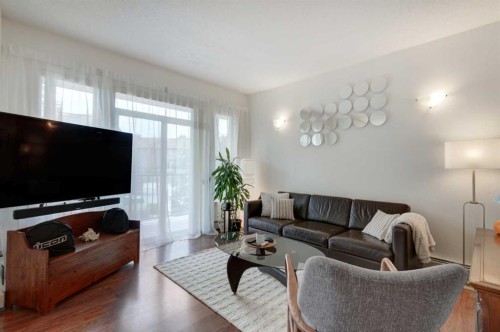1222-211 Aspen Stone Boulevard Sw, Calgary, AB - Indoor Photo Showing Living Room