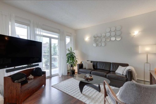 1222-211 Aspen Stone Boulevard Sw, Calgary, AB - Indoor Photo Showing Living Room