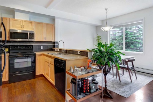 1222-211 Aspen Stone Boulevard Sw, Calgary, AB - Indoor Photo Showing Kitchen With Double Sink