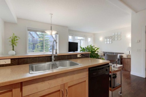 1222-211 Aspen Stone Boulevard Sw, Calgary, AB - Indoor Photo Showing Kitchen With Double Sink