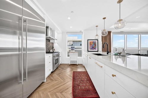 701-8445 Broadcast Avenue Sw, Calgary, AB - Indoor Photo Showing Kitchen With Upgraded Kitchen