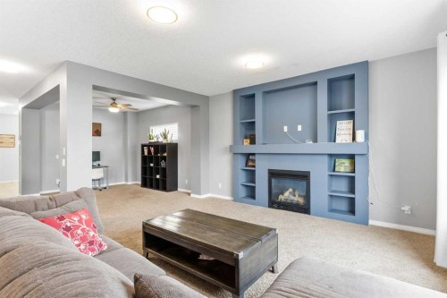 106 Morningside Circle Sw, Airdrie, AB - Indoor Photo Showing Living Room With Fireplace