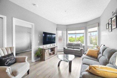 220-8 Prestwick Pond Terrace Se, Calgary, AB - Indoor Photo Showing Living Room