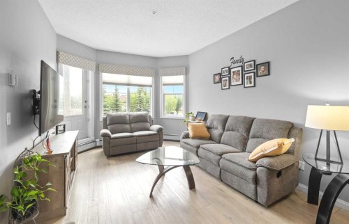 220-8 Prestwick Pond Terrace Se, Calgary, AB - Indoor Photo Showing Living Room