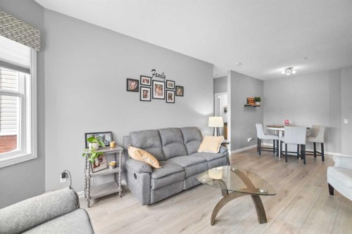 220-8 Prestwick Pond Terrace Se, Calgary, AB - Indoor Photo Showing Living Room