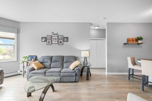 220-8 Prestwick Pond Terrace Se, Calgary, AB - Indoor Photo Showing Living Room