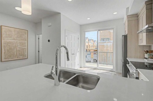 7369 Mercado Avenue Se, Calgary, AB - Indoor Photo Showing Kitchen With Double Sink With Upgraded Kitchen