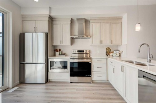 7369 Mercado Avenue Se, Calgary, AB - Indoor Photo Showing Kitchen With Double Sink With Upgraded Kitchen