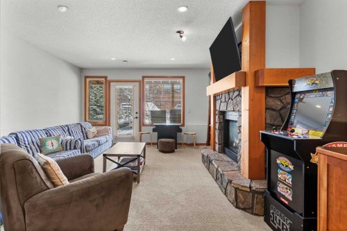 634 4 Street, Canmore, AB - Indoor Photo Showing Living Room With Fireplace