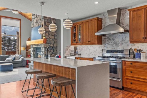634 4 Street, Canmore, AB - Indoor Photo Showing Kitchen With Fireplace