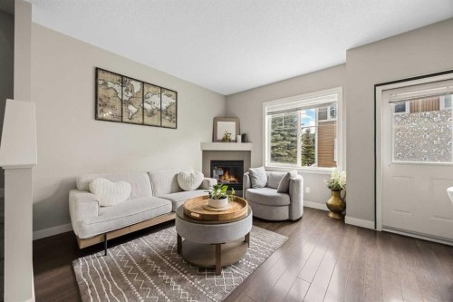 121-300 Marina Drive, Chestermere, AB - Indoor Photo Showing Living Room With Fireplace