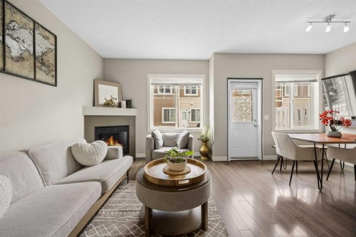 121-300 Marina Drive, Chestermere, AB - Indoor Photo Showing Living Room With Fireplace