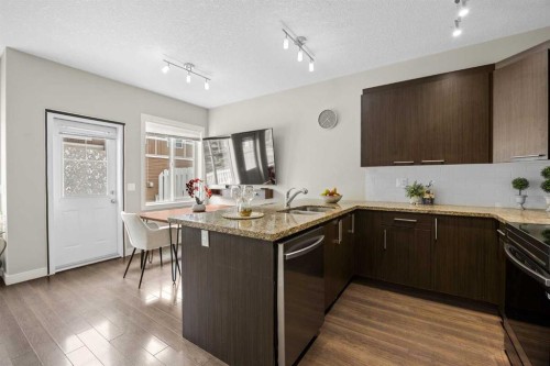 121-300 Marina Drive, Chestermere, AB - Indoor Photo Showing Kitchen With Upgraded Kitchen