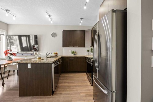 121-300 Marina Drive, Chestermere, AB - Indoor Photo Showing Kitchen With Stainless Steel Kitchen