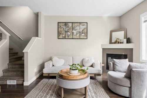 121-300 Marina Drive, Chestermere, AB - Indoor Photo Showing Living Room With Fireplace
