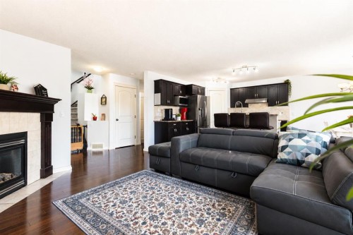 821 Auburn Bay Boulevard Se, Calgary, AB - Indoor Photo Showing Living Room With Fireplace