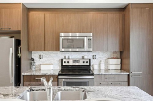 43-300 Marina Drive, Chestermere, AB - Indoor Photo Showing Kitchen With Double Sink With Upgraded Kitchen