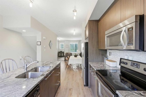 43-300 Marina Drive, Chestermere, AB - Indoor Photo Showing Kitchen With Double Sink With Upgraded Kitchen