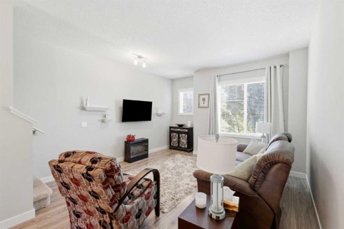 43-300 Marina Drive, Chestermere, AB - Indoor Photo Showing Living Room With Fireplace