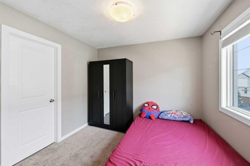 28 New Brighton Point Se, Calgary, AB - Indoor Photo Showing Bedroom