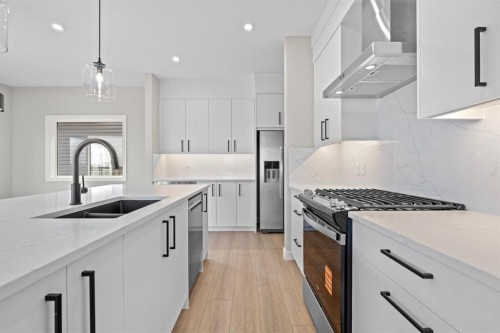 129 Walgrove Bay Se, Calgary, AB - Indoor Photo Showing Kitchen With Stainless Steel Kitchen With Double Sink With Upgraded Kitchen