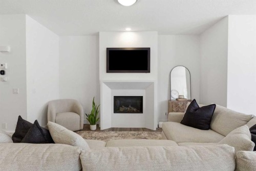 234 Mahogany Passage Se, Calgary, AB - Indoor Photo Showing Living Room With Fireplace