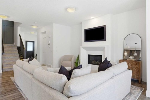 234 Mahogany Passage Se, Calgary, AB - Indoor Photo Showing Living Room With Fireplace