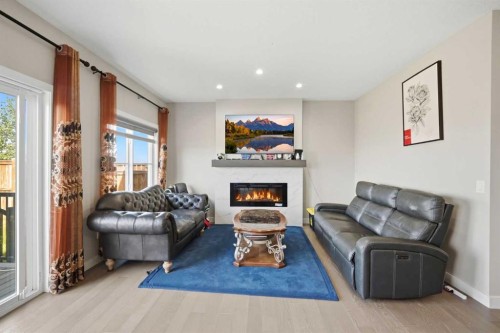 107 Savanna Way Ne, Calgary, AB - Indoor Photo Showing Living Room With Fireplace