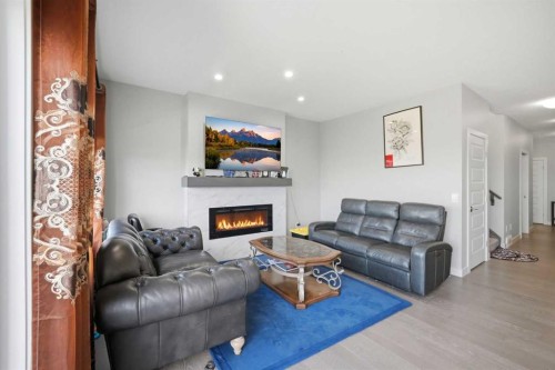 107 Savanna Way Ne, Calgary, AB - Indoor Photo Showing Living Room With Fireplace