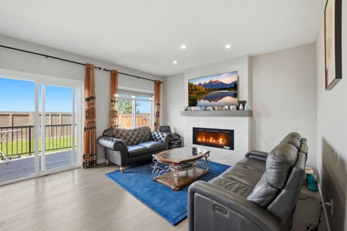 107 Savanna Way Ne, Calgary, AB - Indoor Photo Showing Living Room With Fireplace