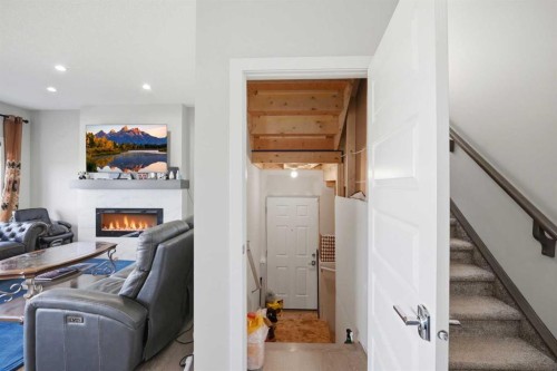 107 Savanna Way Ne, Calgary, AB - Indoor Photo Showing Other Room With Fireplace