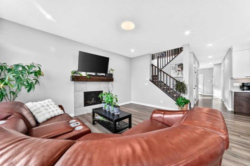 263 Chelsea Heath, Chestermere, AB - Indoor Photo Showing Living Room With Fireplace