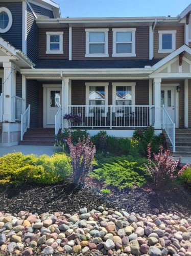 268 Sunset Road, Cochrane, AB - Outdoor With Deck Patio Veranda With Facade