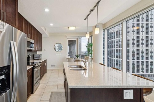 1507-211 13 Avenue Se, Calgary, AB - Indoor Photo Showing Kitchen With Stainless Steel Kitchen With Double Sink With Upgraded Kitchen