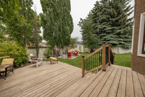 19 Mckenzie Lake Manor Se, Calgary, AB - Outdoor With Deck Patio Veranda With Backyard