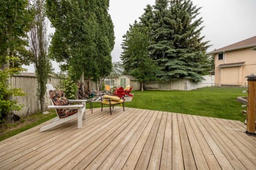 19 Mckenzie Lake Manor Se, Calgary, AB - Outdoor With Deck Patio Veranda With Backyard