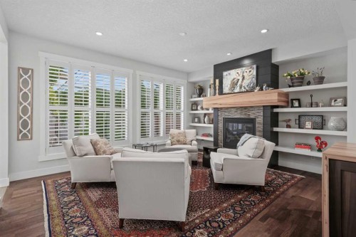 30 And 30G Victoria Cross Boulevard Sw, Calgary, AB - Indoor Photo Showing Living Room With Fireplace