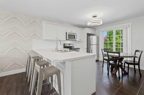 30 And 30G Victoria Cross Boulevard Sw, Calgary, AB - Indoor Photo Showing Kitchen With Double Sink
