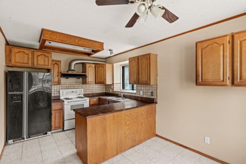 72 Templeson Way Ne, Calgary, AB - Indoor Photo Showing Kitchen With Double Sink