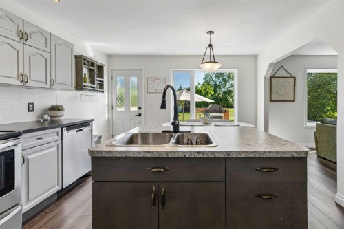 52 West Edge Road, Cochrane, AB - Indoor Photo Showing Kitchen With Double Sink