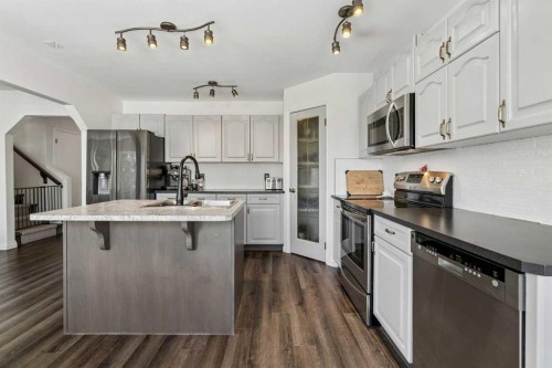 52 West Edge Road, Cochrane, AB - Indoor Photo Showing Kitchen With Stainless Steel Kitchen With Upgraded Kitchen
