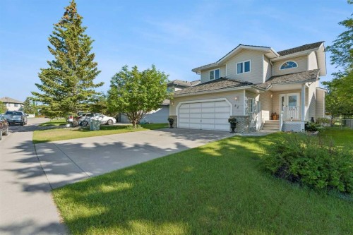 52 West Edge Road, Cochrane, AB - Outdoor With Facade