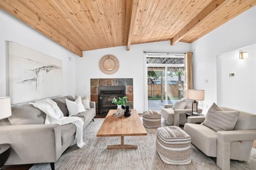 2623 Glenmount Drive Sw, Calgary, AB - Indoor Photo Showing Living Room With Fireplace