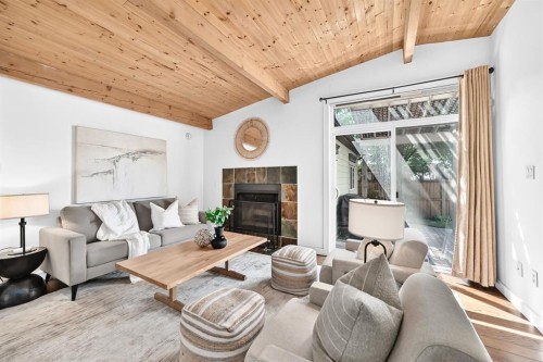 2623 Glenmount Drive Sw, Calgary, AB - Indoor Photo Showing Living Room With Fireplace