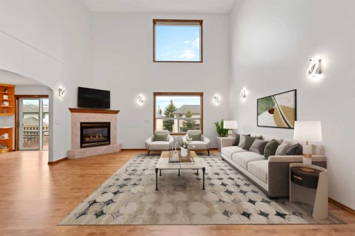410 Long Beach Landing, Chestermere, AB - Indoor Photo Showing Living Room With Fireplace
