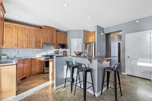 716 Boulder Creek Drive Se, Langdon, AB - Indoor Photo Showing Kitchen With Stainless Steel Kitchen