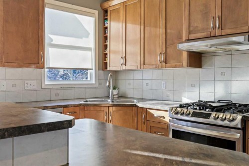 716 Boulder Creek Drive Se, Langdon, AB - Indoor Photo Showing Kitchen With Stainless Steel Kitchen With Double Sink