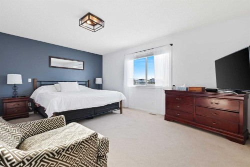 716 Boulder Creek Drive Se, Langdon, AB - Indoor Photo Showing Bedroom