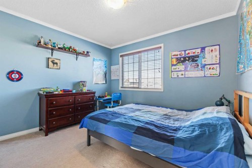 716 Boulder Creek Drive Se, Langdon, AB - Indoor Photo Showing Bedroom